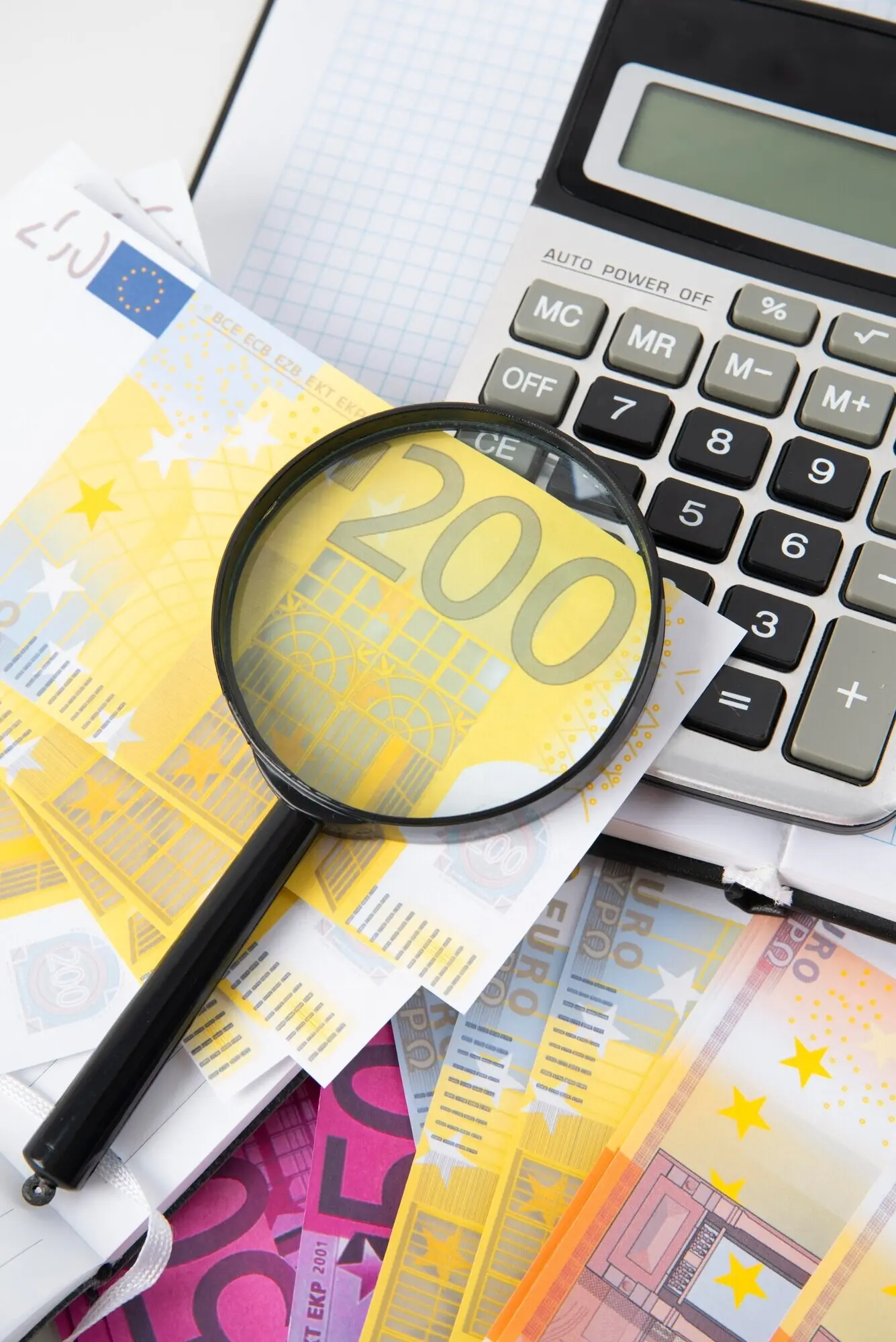 Close-up of objects related to education and the economy.